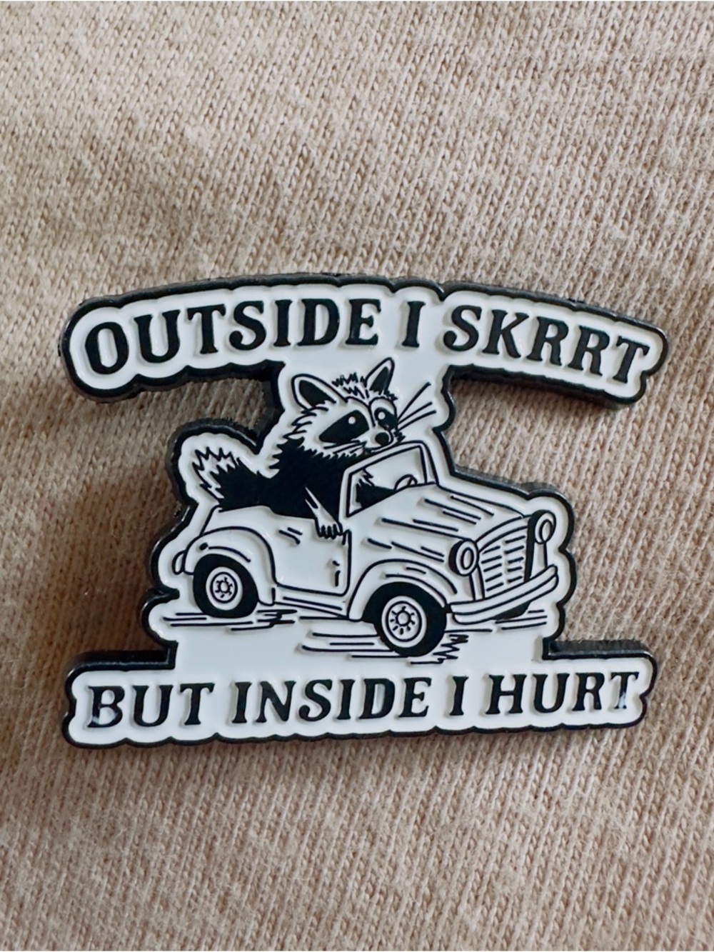 Outside I Skrrt But Inside I Hurt Racoon Enamel Pin - Black & White